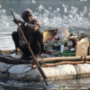 Man in floating recycled raft.